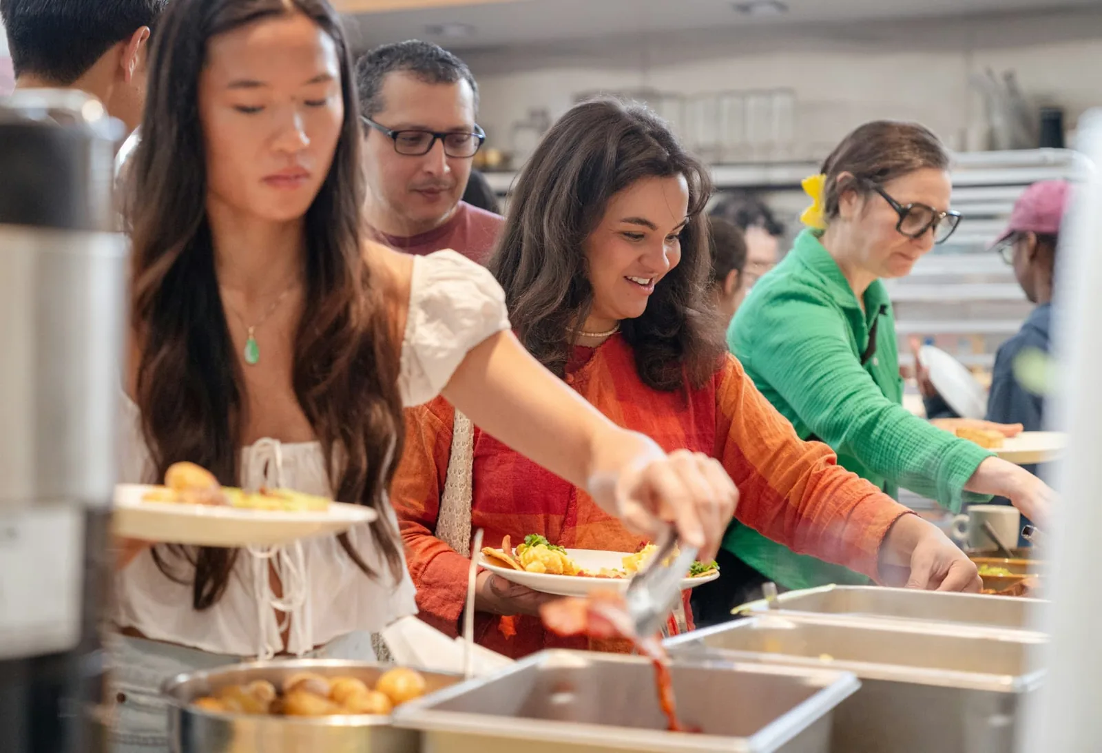 Guests selecting food from a buffet