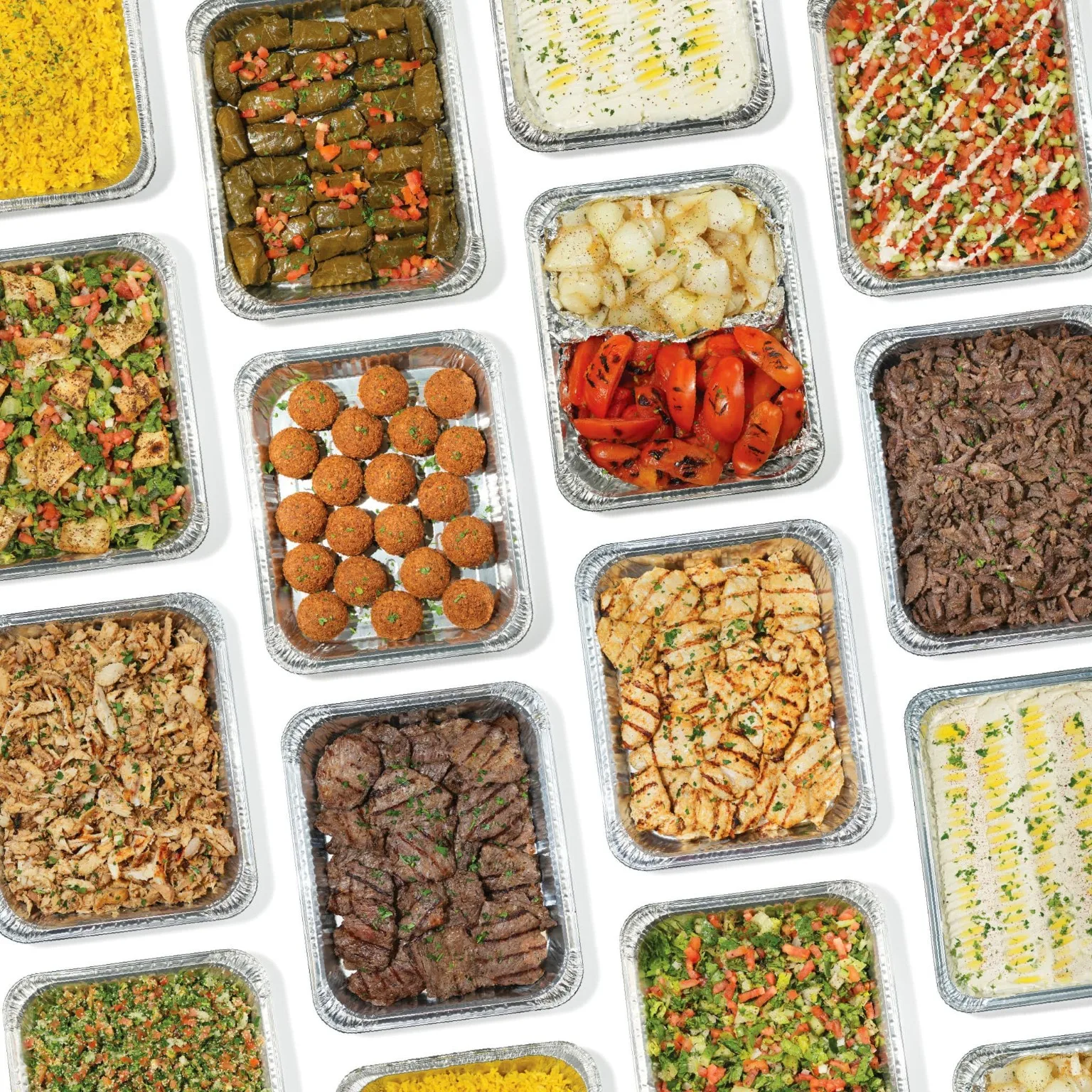 Assorted Mediterranean catering trays with meat, rice, falafel, vegetables and dips.